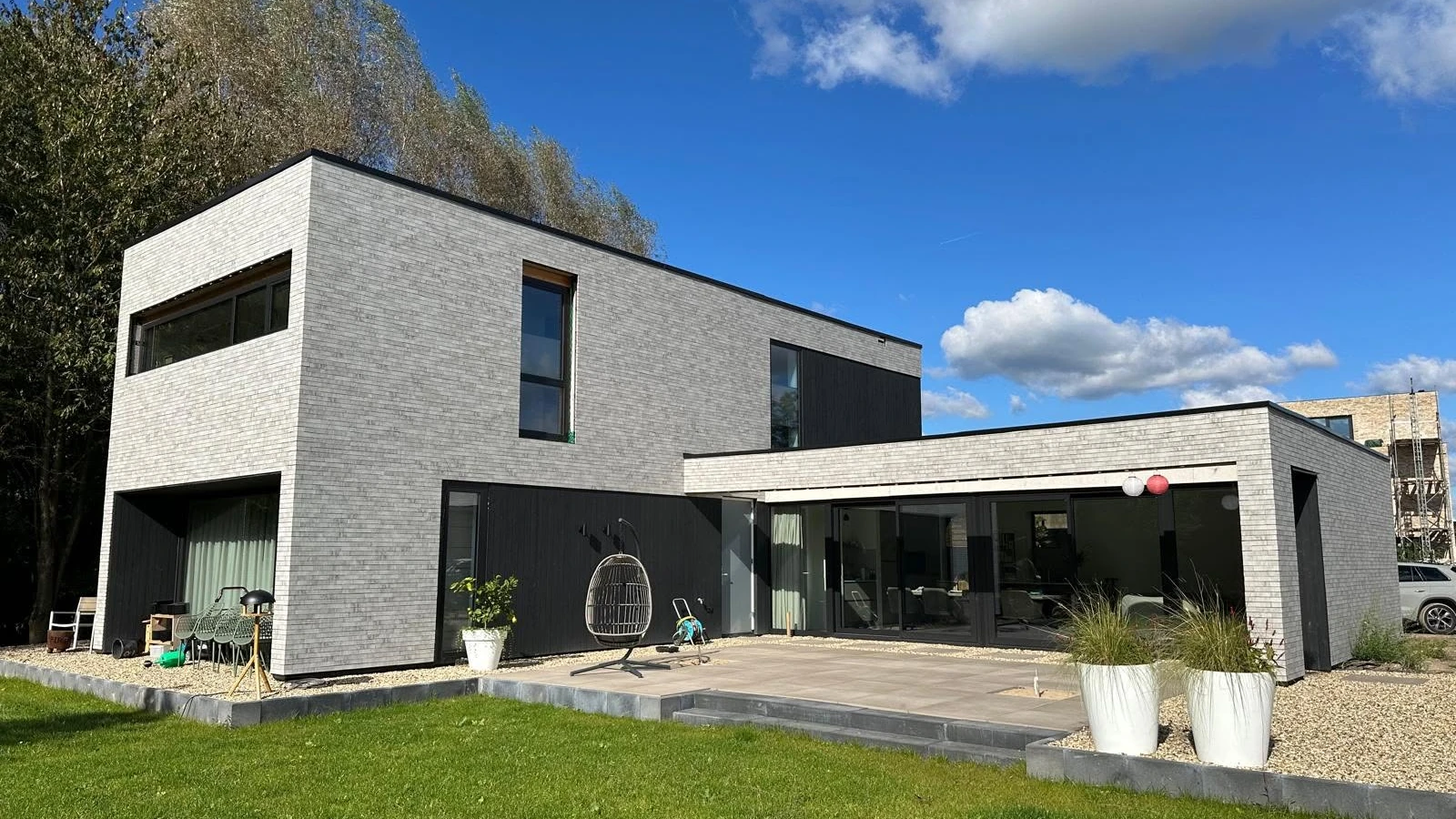 Completed Arnhem timber-frame residence with brick and dark timber cladding