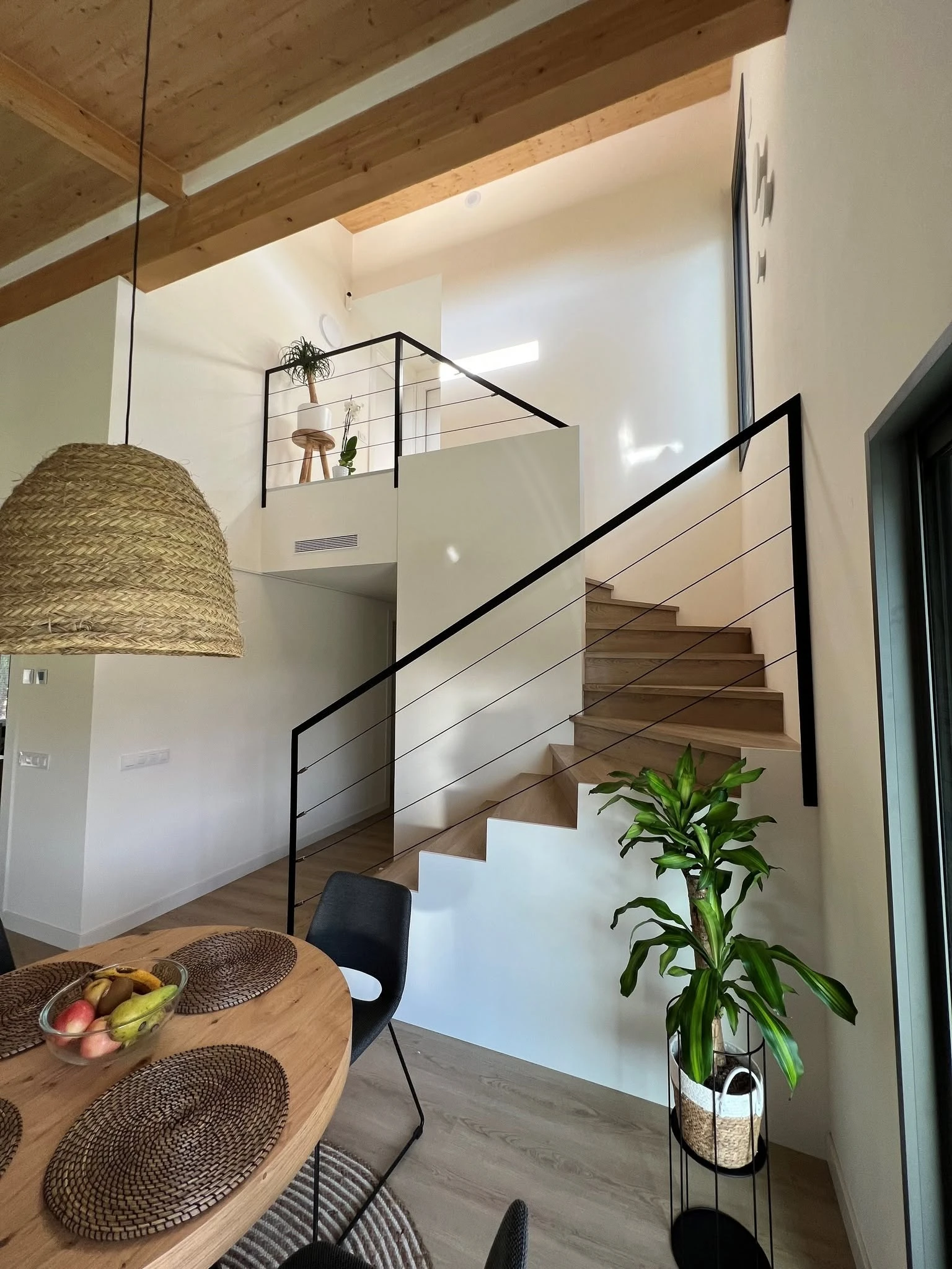 Interior stair and mezzanine detail in the Barcelona residence
