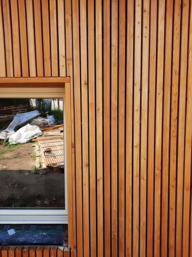 Close-up of window surround and larch slat texture