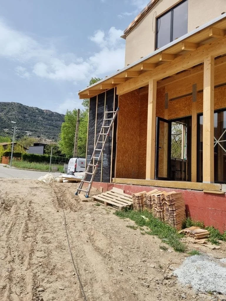 On-site progress image showing the covered porch structure