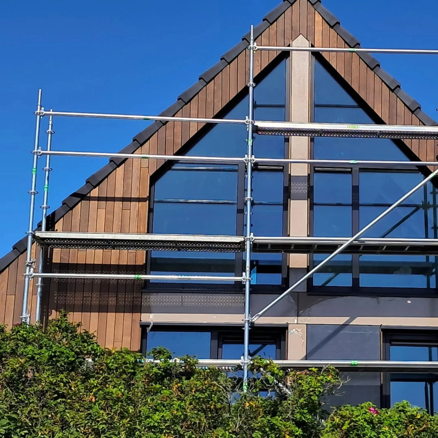 Detailed glazed gable of the Dutch timber and steel hybrid residence