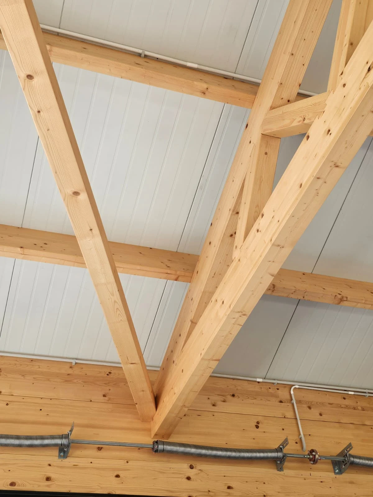 Detail of a timber truss connection and machined structural members