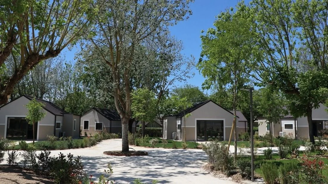 Landscaped courtyard between prefabricated hospitality units
