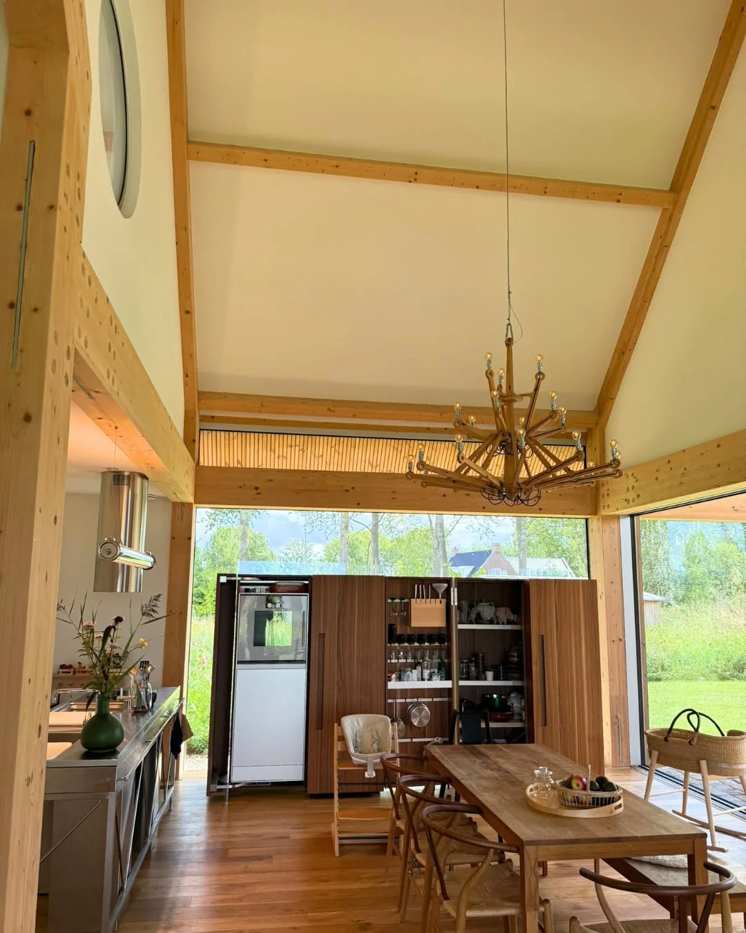 Open-plan interior within a visible Post and Beam frame