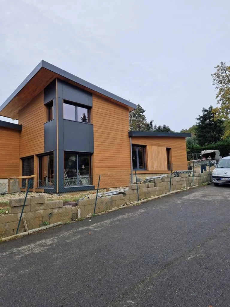 Street-side view of the Parisian protected-area larch residence nearing completion